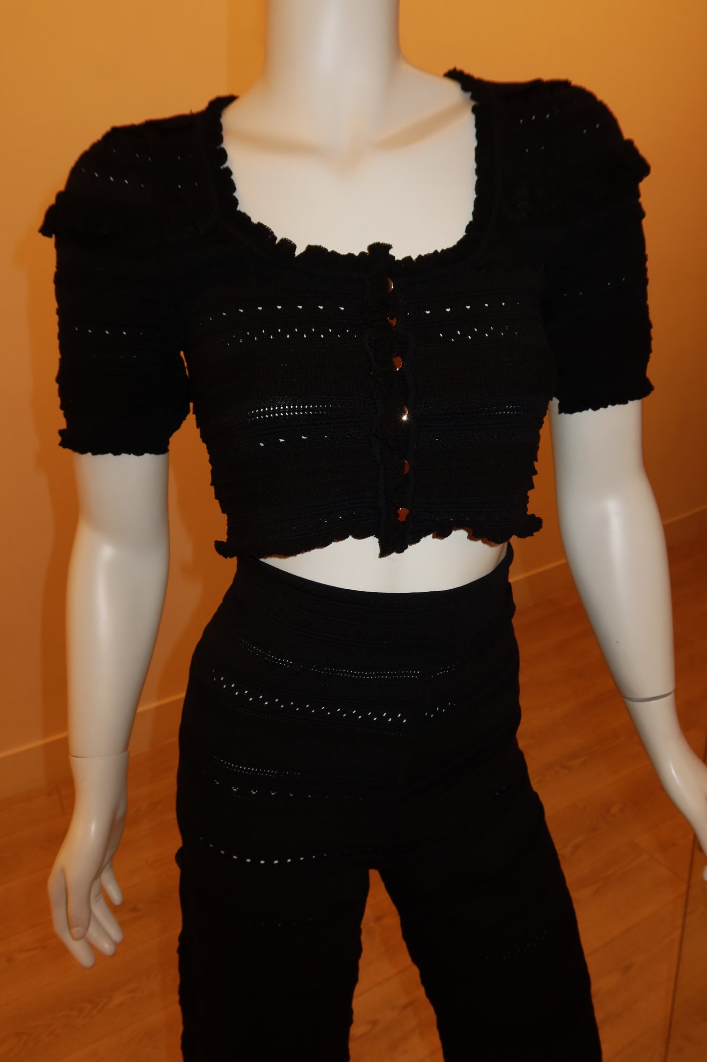 Close-up rib texture on black knit set – Palms of T