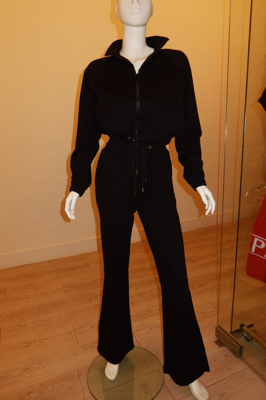Black zip-front track suit on mannequin, full look