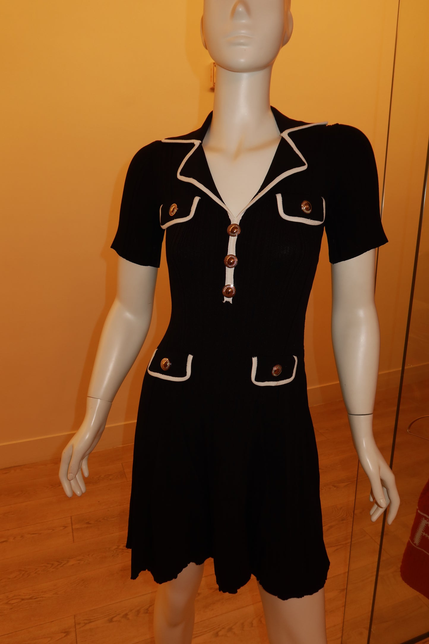 Pocket flap with silver button, close-up — Palms of T